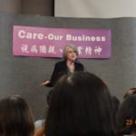 The speaker shares on the podium photo 1.